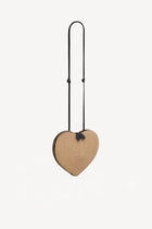 Front slanted view of natural heart bag in straw on white background, with no model shown