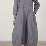 Front view of fog letty dress on model wearing black oxfords against a white background.