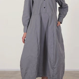 Front view of fog letty dress on model wearing black oxfords against a white background.