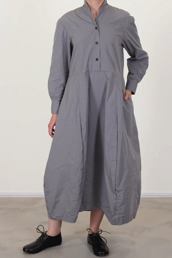 Front view of fog letty dress on model wearing black oxfords against a white background.