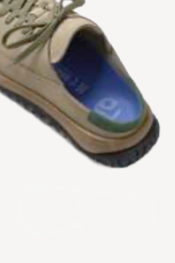 Leftside overview of uerzell sneaker on white background, with no model shown.