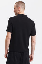 Loose-fit short-sleeved polo shirt in cotton crepe links knit