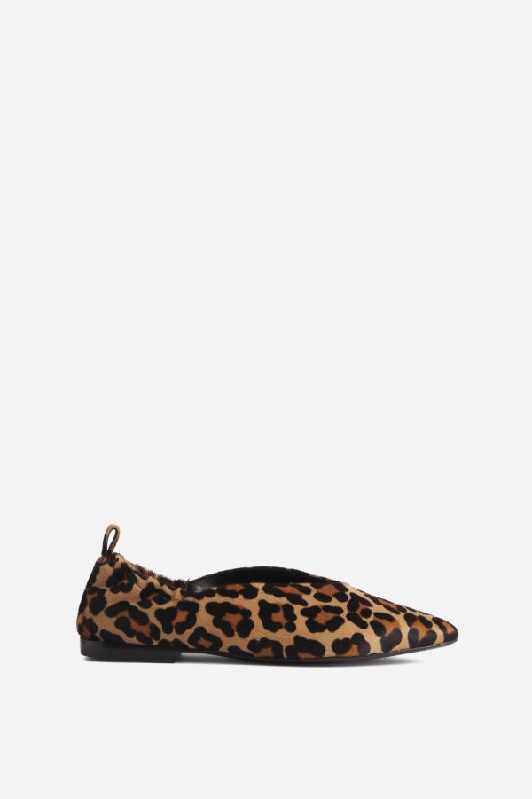 Right side view of leopard pointed elasticized slipper on white background, with no. model shown.