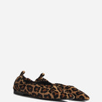 Front slanted view of leopard pointed elasticized slipper on white background, with no model shown.