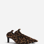 Front slanted view of leopard calf hair pointed ruched pumps on white background, with no model shown.