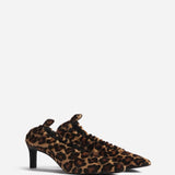 Front slanted view of leopard calf hair pointed ruched pumps on white background, with no model shown.