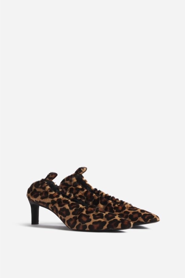Front slanted view of leopard calf hair pointed ruched pumps on white background, with no model shown.