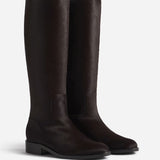 Pair view of chocolate calf hair riding boot, on white background, with no model shown.