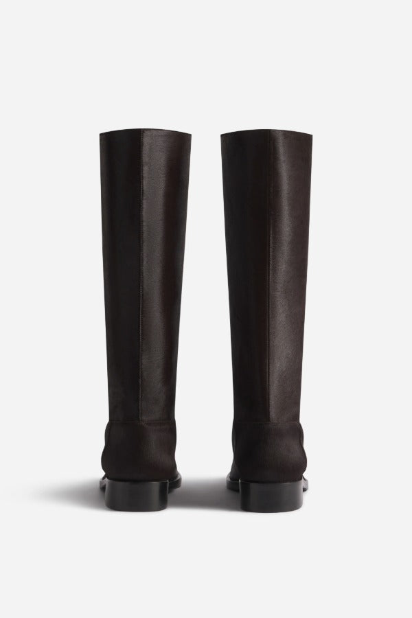 Back view of chocolate calf hair riding boots on white background, with no model shown.