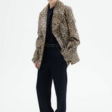 Alternate front view of leopard peacoat on model wearing black top and pants, against a white background.