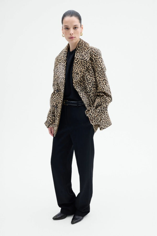 Alternate front view of leopard peacoat on model wearing black top and pants, against a white background.