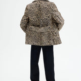 Back view of leopard peacoat on model wearing black pants, against a white background.