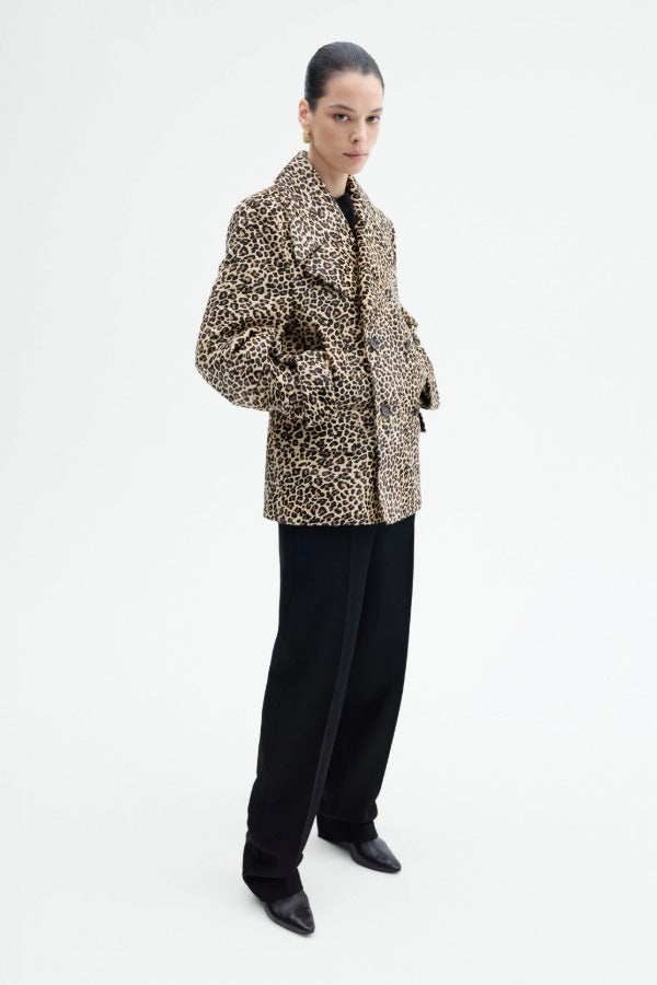 Alternate side view of leopard peacoat on model wearing black top and pants, against a white background.