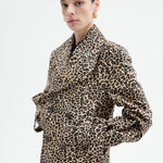 Alternate front view of leopard peacoat on model wearing black top and pants, against a white background.