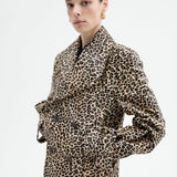 Alternate front view of leopard peacoat on model wearing black top and pants, against a white background.