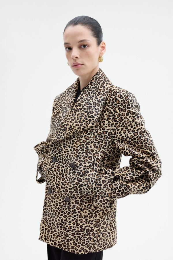 Alternate front view of leopard peacoat on model wearing black top and pants, against a white background.