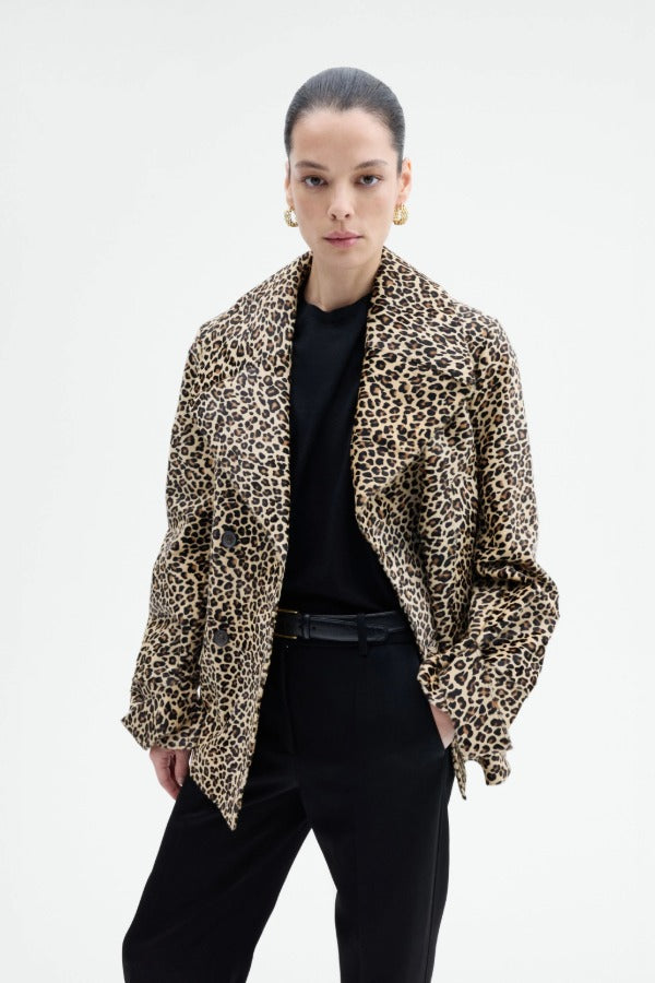 Front view of leopard peacoat on model wearing black top and pants, against a white background.