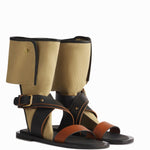 Side view of ecru gladiator wrap sandal on white background, with no model shown.