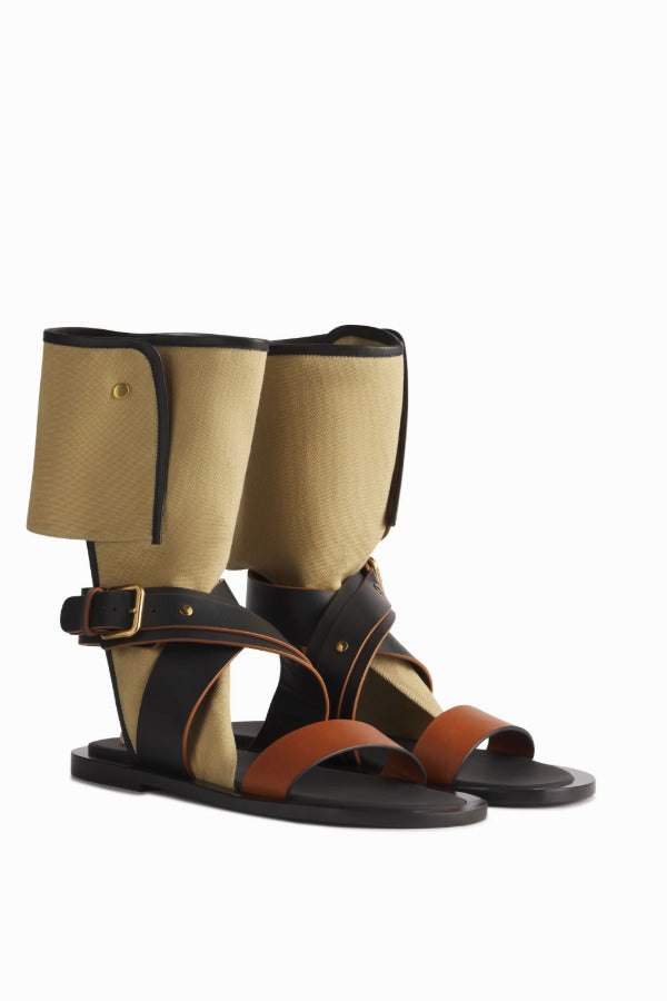 Side view of ecru gladiator wrap sandal on white background, with no model shown.