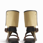 Back view of ecru gladiator wrap sandal on white background, with no model shown.