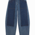 Front view of indigo denim patchwork pants on white background, with no model shown.
