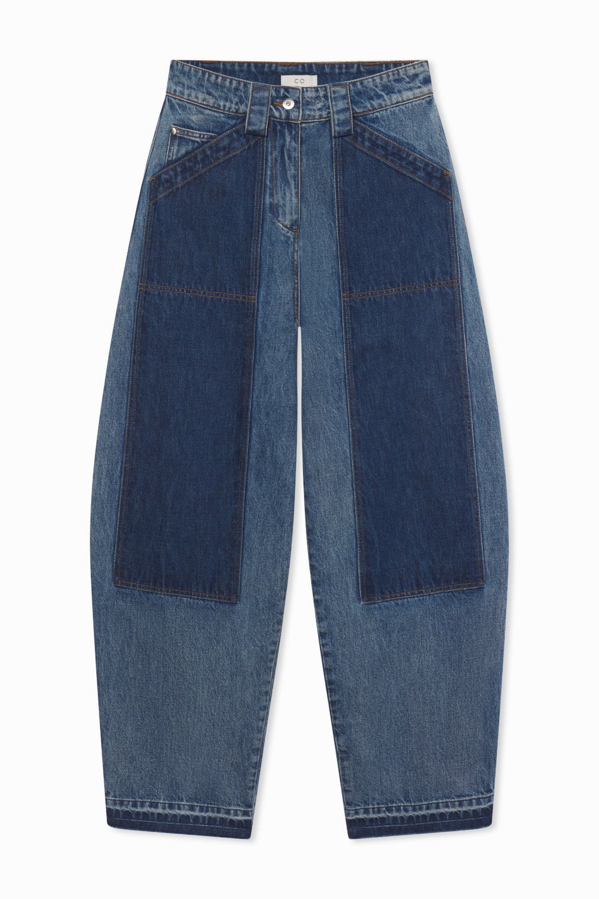Front view of indigo denim patchwork pants on white background, with no model shown.