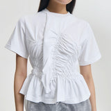 Front closeup view of white ace t-shirt on model, against a white background