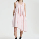 Front view of blush pink azelia dress on model wearing black sneakers and socks, against a white background.