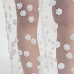 Front closeup view of gus skirt on model, against a white background.