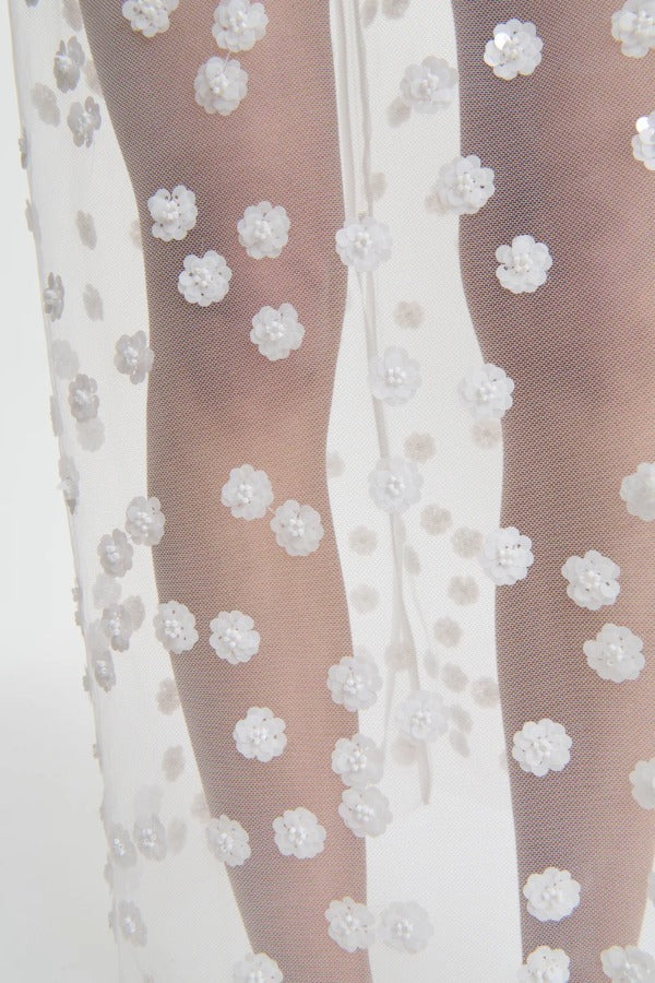 Front closeup view of gus skirt on model, against a white background.