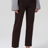 Alternate front view of barrister caia pants on model wearing grey sweater and heels, against a white background.