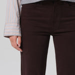 Front closeup view of barrister caia pants on model wearing grey sweater, against a white background.
