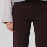 Front closeup view of barrister caia pants on model wearing grey sweater, against a white background.