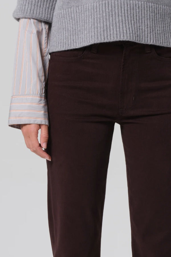 Front closeup view of barrister caia pants on model wearing grey sweater, against a white background.
