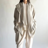 Front view of moonbeam cashmere shawl coat on model wearing white top and pants, against a white background.
