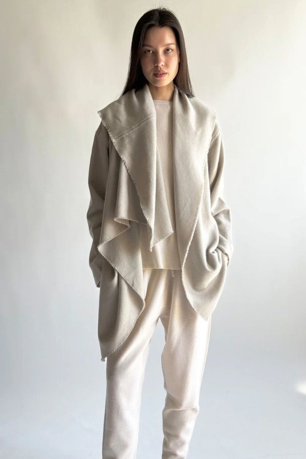 Front view of moonbeam cashmere shawl coat on model wearing white top and pants, against a white background.