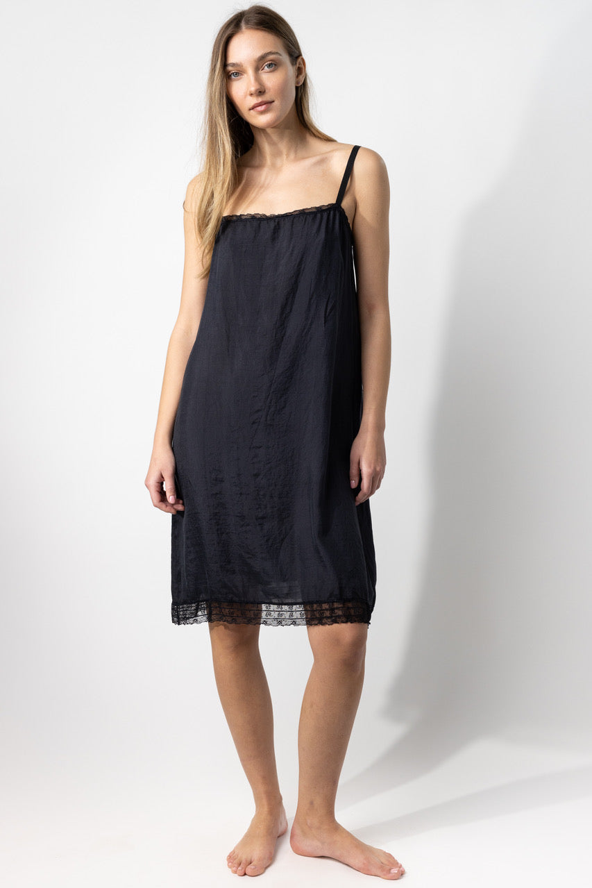 Front view of midnight dosa chemise slip on model, against a white background