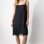 Front view of midnight dosa chemise slip on model, against a white background