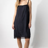 Front view of midnight dosa chemise slip on model, against a white background