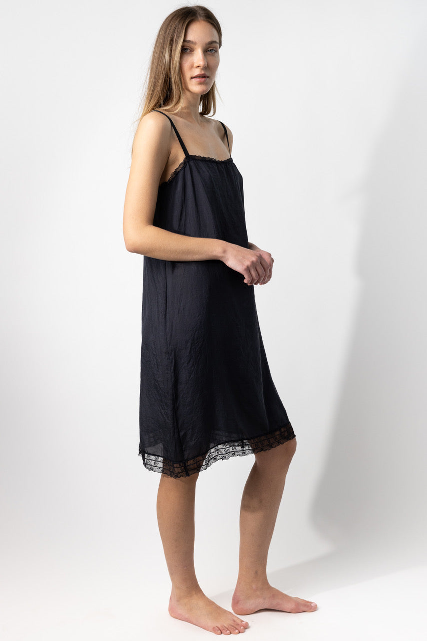 Side view of midnight dosa slip on model, against a white background.