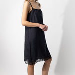 Side view of midnight dosa slip on model, against a white background.