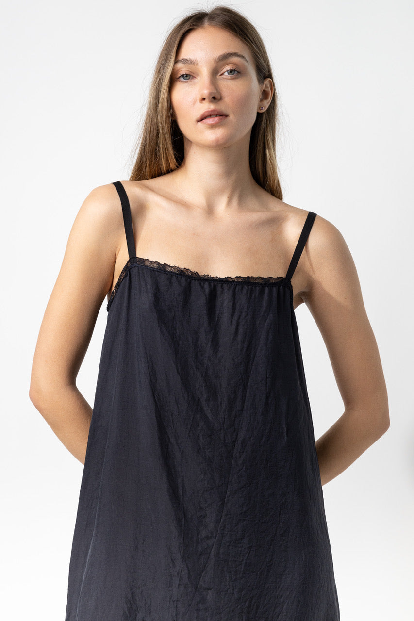 Front closeup view of midnight chemise slip on model, against a white background.