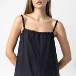 Front closeup view of midnight chemise slip on model, against a white background.