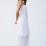 Side view of rice chemise slip on model wearing rice pants and natural sandals, against a white background.