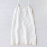 Front view of rice chemise slip on white background, with no model shown.