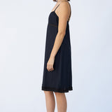 Side view of midnight kymber slip on model wearing natural sandals, against a white background.