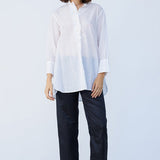 Front view of rice little subhash shirt on model wearing midnight pants and natural sandals against a white background.