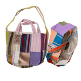 Front and overhead view of multicolor dosa luna bag on white background, with no model shown.