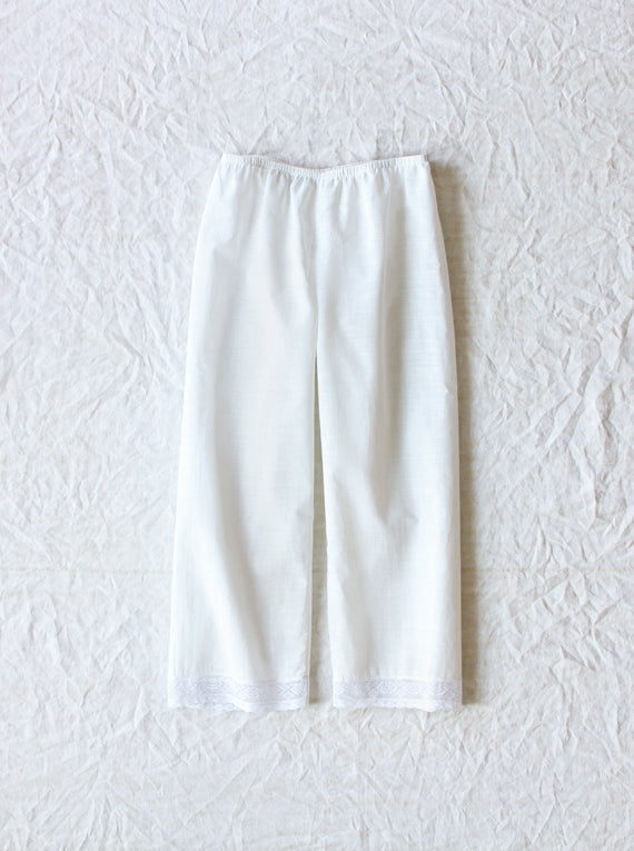 Front view of rice pants with lace on white background, with no model shown.