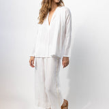 Side view of rice pants with velvet ribbon on model wearing rice top and natural sandals, against a white background.